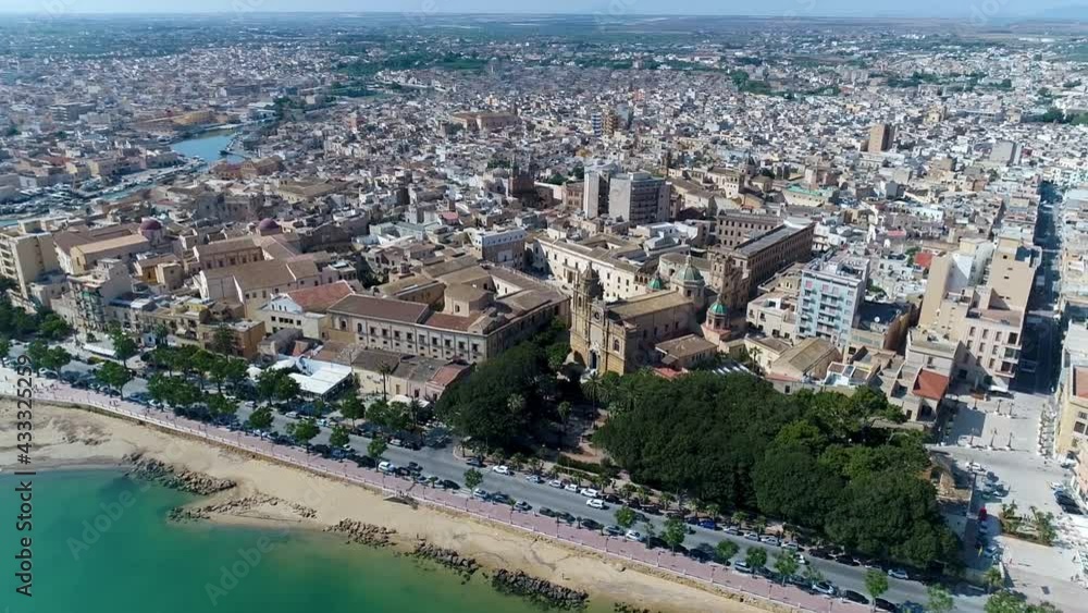 aerial top view with drone of the cathedral of SS Salvatore in Mazara del Vallo, Province of Trapani, Sicily overlooking the Mediterranean sea aerial top view with drone of the cathedral of SS Salvatore in Mazara del Vallo, Province of Trapani, Sicily overlooking the Mediterranean sea