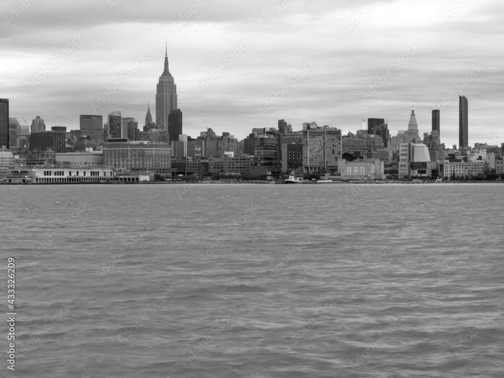 Empire State building in New York city across Hudson river