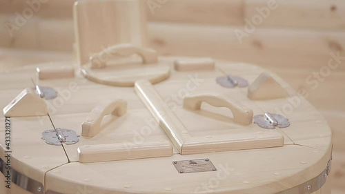 In the spa room there is a cedar phyto-barrel with wooden doors close-up