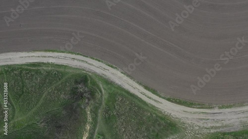road bend, paths between desert field and forest, landscape top view, dynamic line and a lot of air, wild world space, country industry