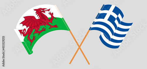 Crossed and waving flags of Wales and Greece