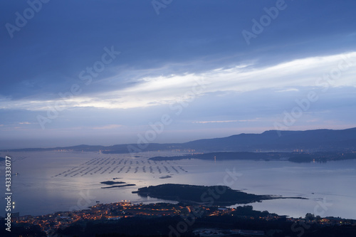 town of Carril in the Arousa estuary at dusk with panoramic views of the entire estuary and the mussel farms