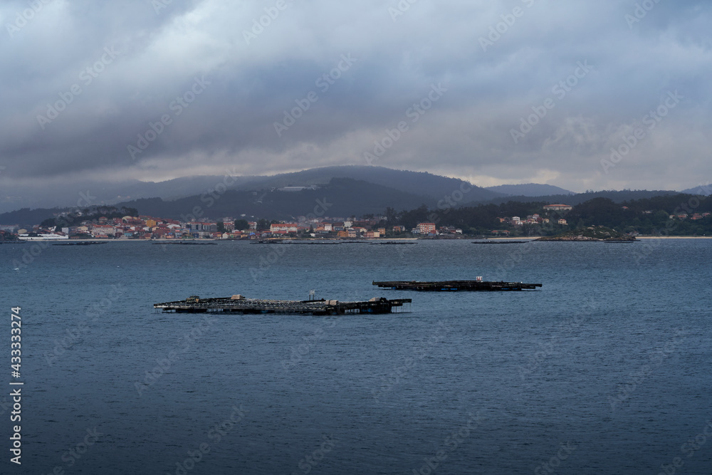 mussel farms in the middle of the sea in the ría de arousa in Galicia