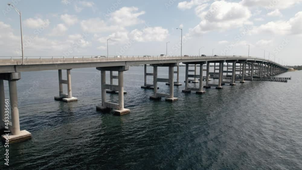 Medium aerial drone shot of traffic on causeway bridge on a beautiful sunny day. Medium aerial drone shot of traffic on causeway bridge on a beautiful sunny day.