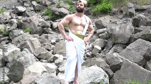 Slow Motion Greek God On A Background Of Trees And Vines