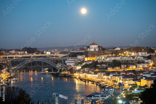 Panoramic view on Douro river and old part of Porto city in Portugal at night