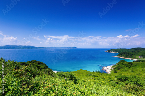 Beautiful summer landscape with Furugelm island. View from above. A beautiful bay of a protected island in the summer. The beautiful coast of the protected island against the backdrop of the blue sea.