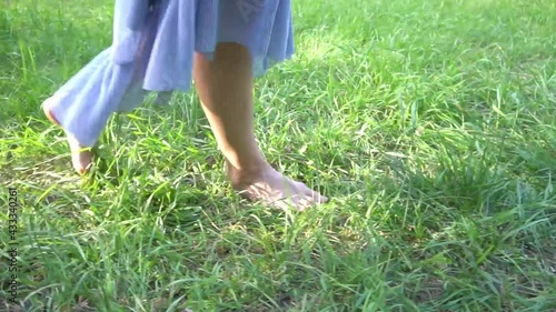 Woman walking in grass
