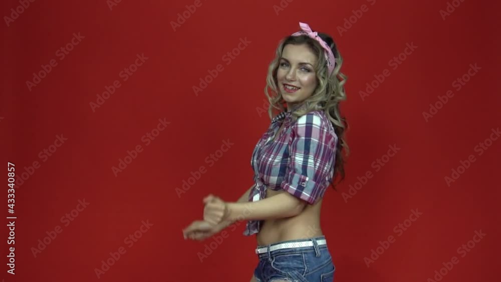 Woman with curly hair dancing and enjoying music Woman with curly hair dancing and enjoying music