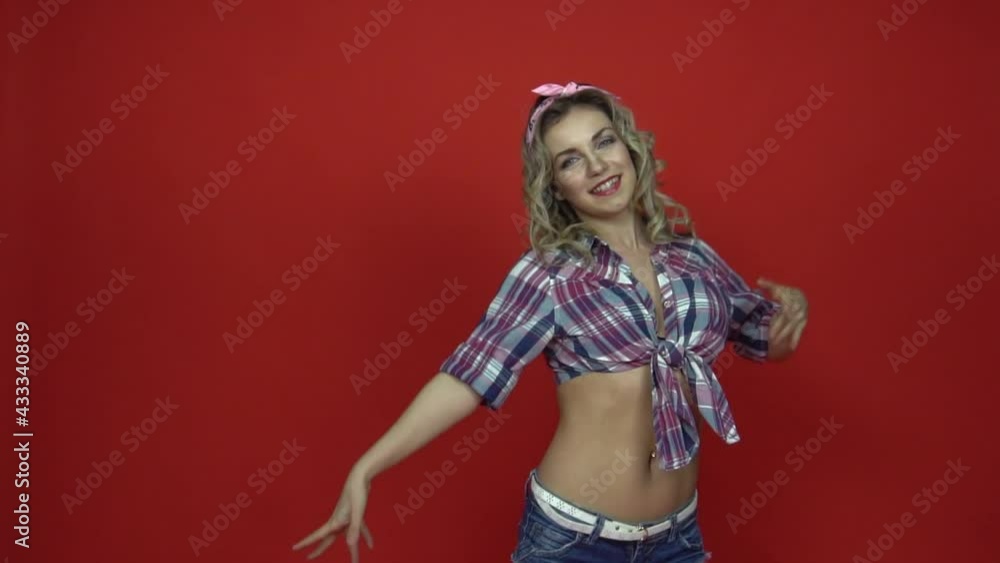 Slow Motion Adorable romantic teenage woman on red background Slow Motion Adorable romantic teenage woman on red background