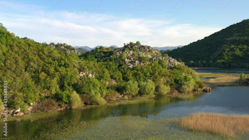 Aerial view of rocks and mountains with green trees and bush on Skadar lake national park in spring, Montenegro Aerial view of rocks and mountains with green trees and bush on Skadar lake national park in spring, Montenegro