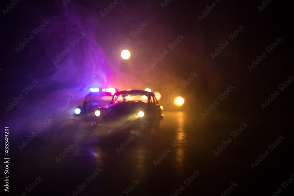 Police car chasing a car at night with fog background. 911 Emergency response police car speeding to scene of crime. Police car chasing a car at night with fog background. 911 Emergency response police car speeding to scene of crime.