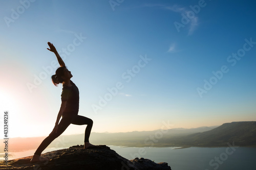 woman doing yoga on the mountain