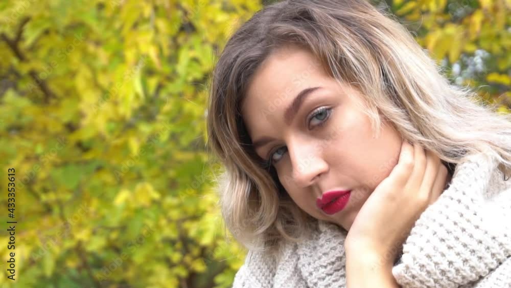 Slow Motion Beautiful smiling young woman in autumn