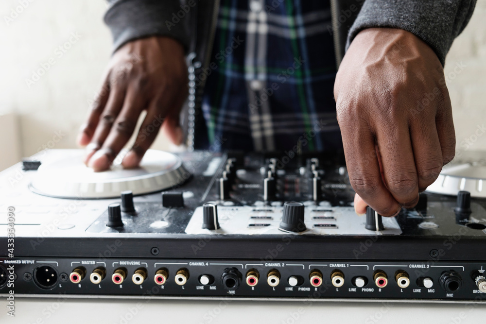 DJ using mixing desk, close up DJ using mixing desk, close up