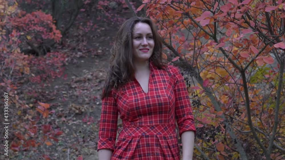 Happy woman with autumn yellow leaves outside in the autumn. Happy woman with autumn yellow leaves outside in the autumn.