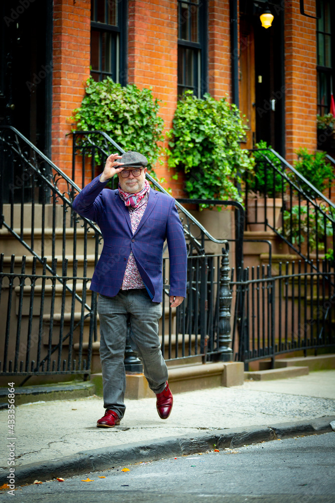 bohemian artist man in colorful clothes walking in the west village in New York bohemian artist man in colorful clothes walking in the west village in New York