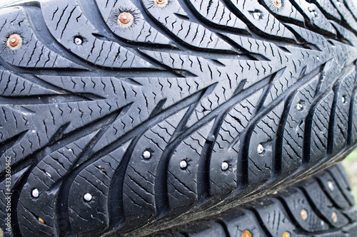 Old winter car tire. Winter car tire repair.