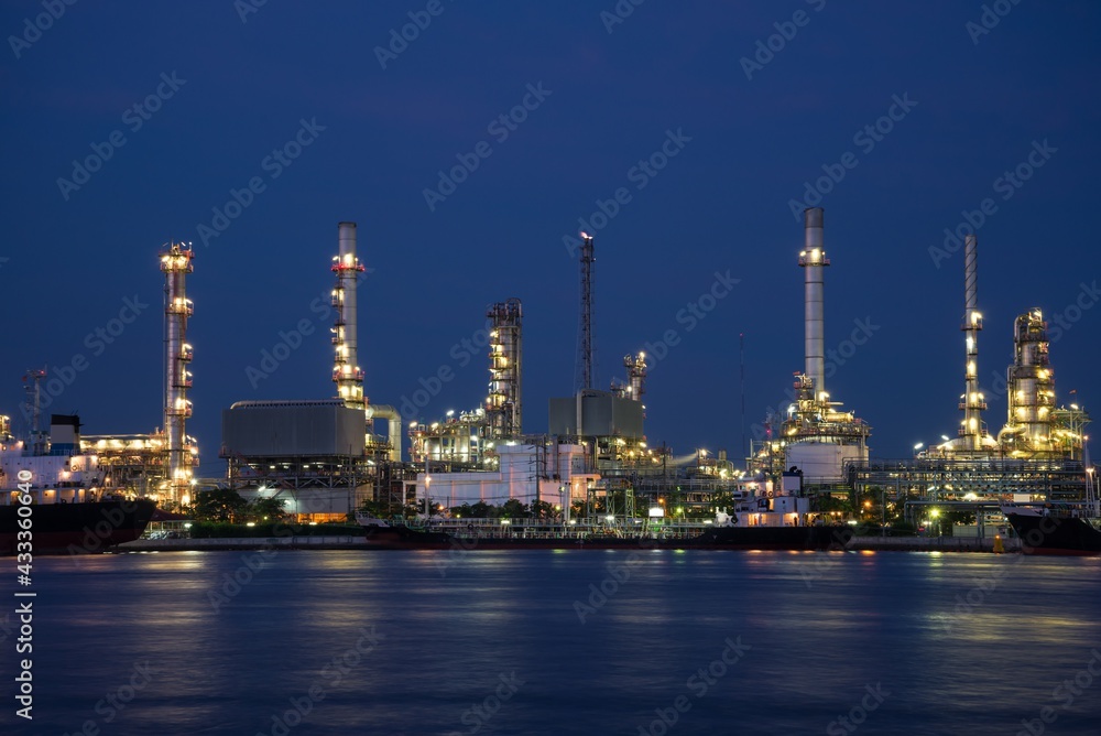 Oil refinery plant factory in industry economic zone. Petrochemical, petroleum, power energy and engineering concept