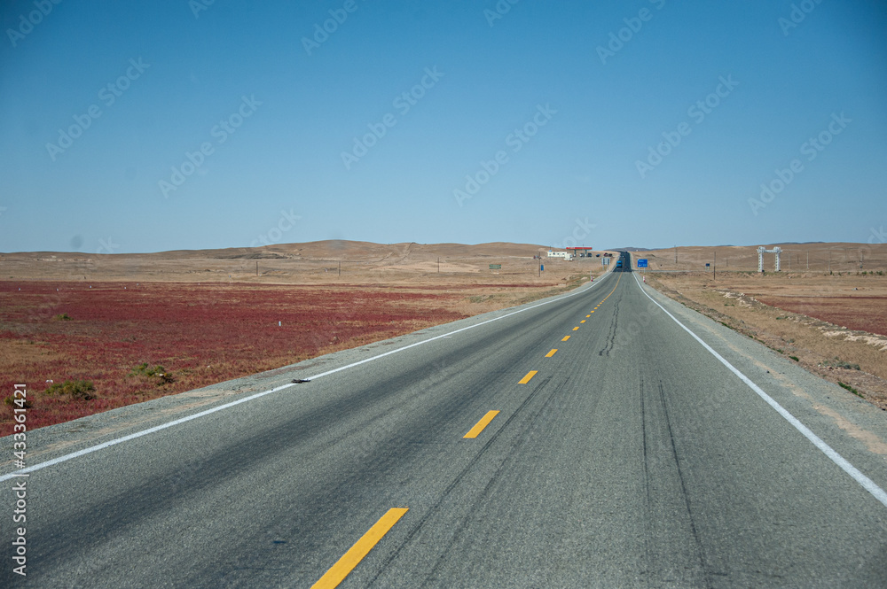 the long rural road in the desert area