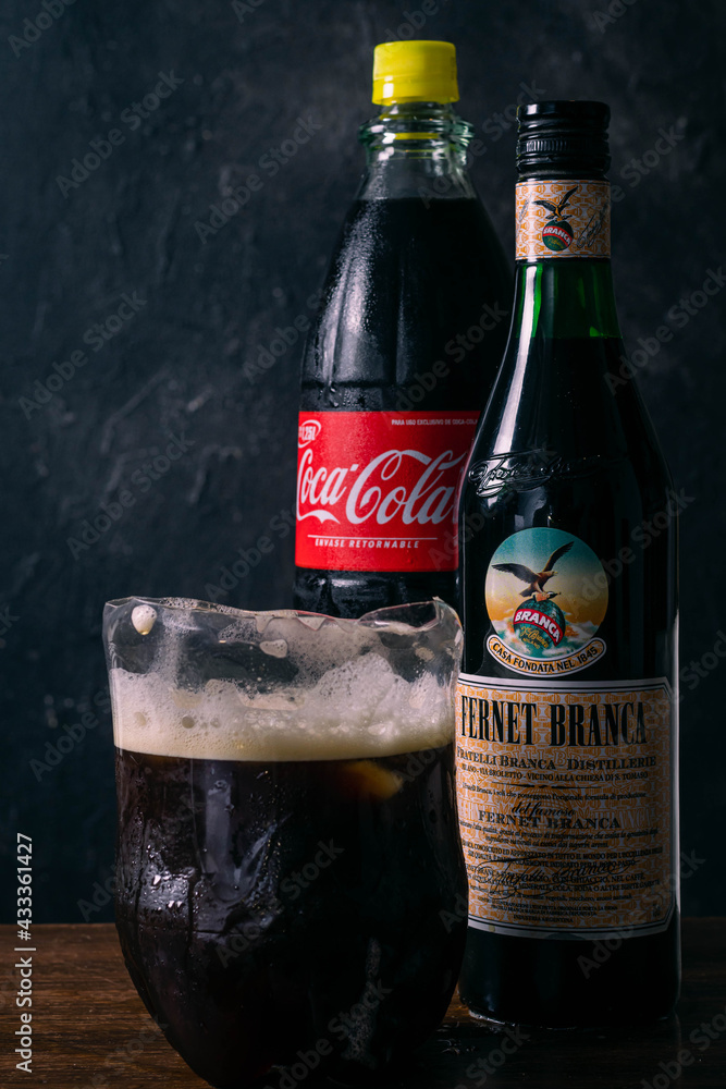 cordoba argentina may 13, 2021 splash of traditional cordoba argentina  fernet drink with cola with cut plastic bottle glass Stock Photo | Adobe  Stock