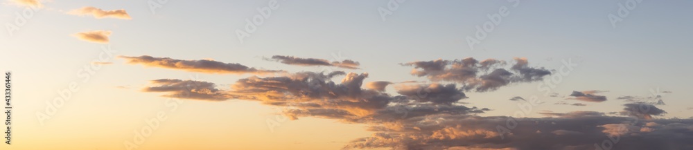 Panoramic View of Cloudscape with puffy sky and clear sunny sunlight during a colorful sunset or sunrise. Taken on the West Coast of British Columbia, Canada.