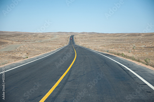 the long rural road in the desert area