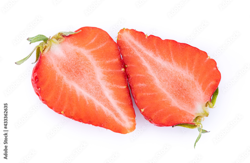 Two halves of cut strawberries on a white background, isolated Two halves of cut strawberries on a white background, isolated
