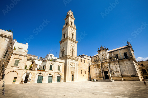 Square of the famous basilica Church of the Holy Cross. Historic city of Lecce, Italy. Blue sky cloudless. © angelocordeschi