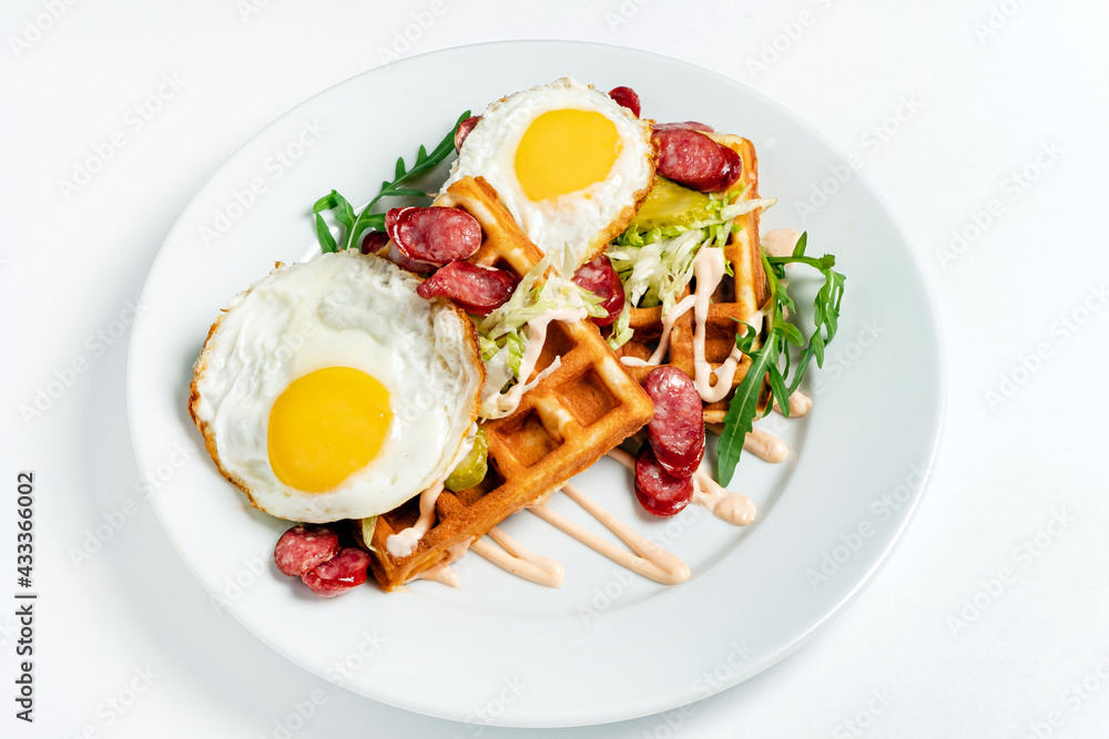breakfast with belgian waffles on white plate breakfast with belgian waffles on white plate