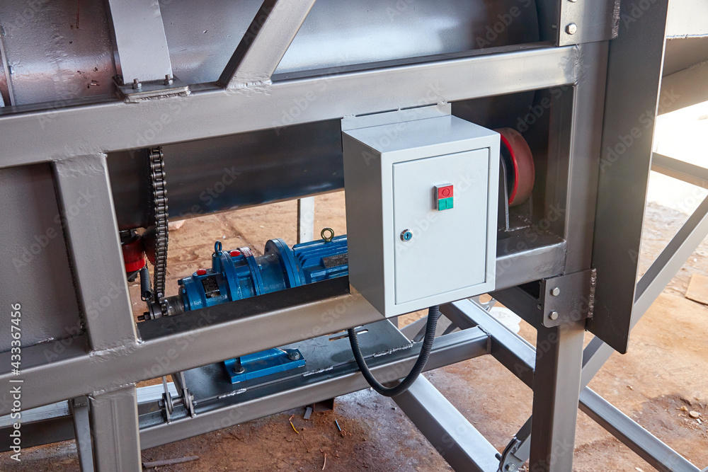 part of steel frame of equipment with a control cabinet installed part of steel frame of equipment with a control cabinet installed
