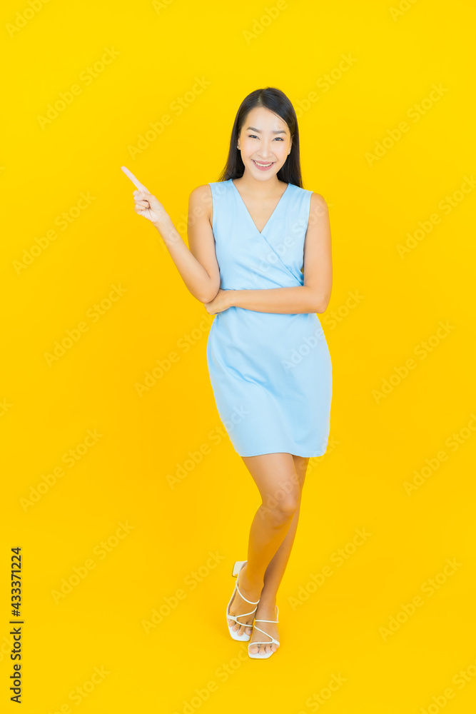 Portrait beautiful young asian woman smile with action Portrait beautiful young asian woman smile with action