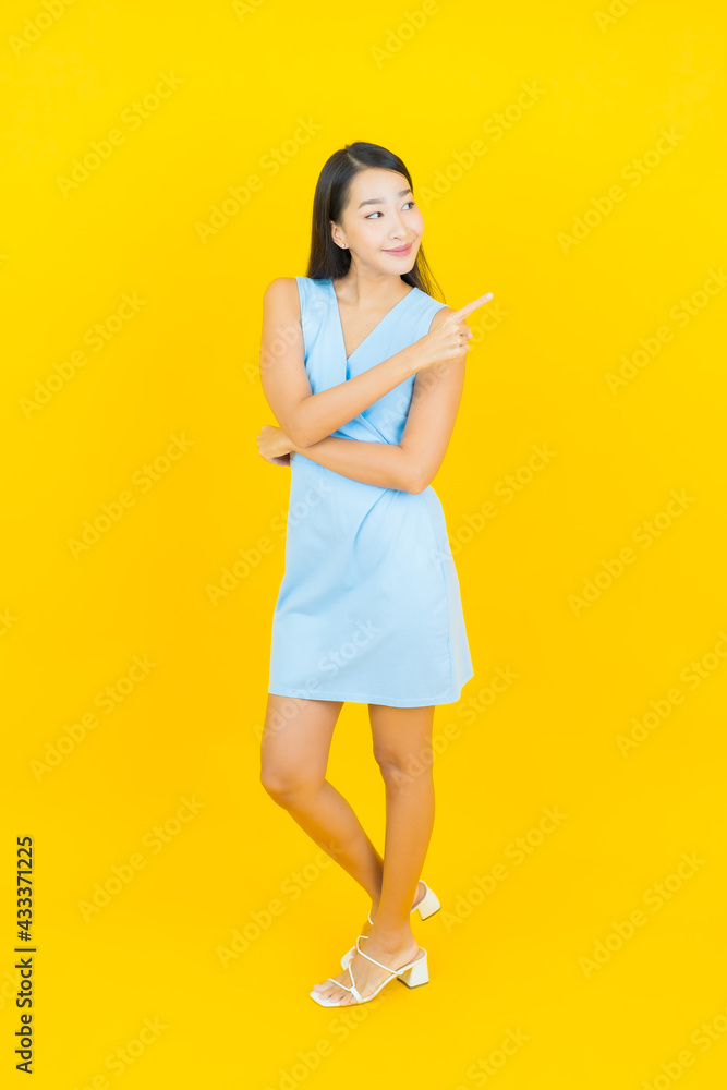 Portrait beautiful young asian woman smile with action Portrait beautiful young asian woman smile with action