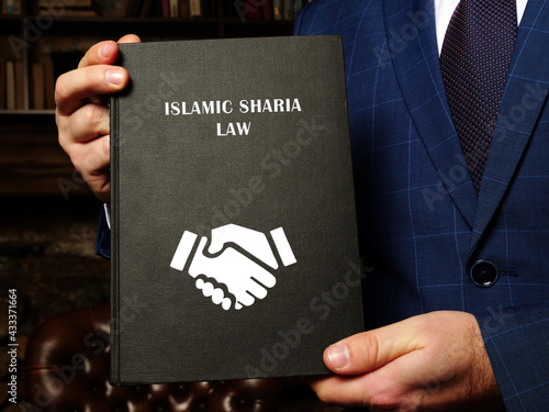  ISLAMIC SHARIA LAW book's title. Sharia law is Islam's legal system. It is derived from both the Koran