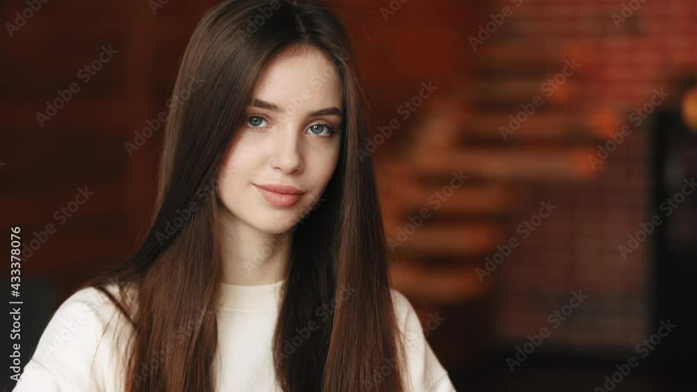 Portrait Shooting. The woman is looking at the camera and smiling. 4K Portrait Shooting. The woman is looking at the camera and smiling. 4K