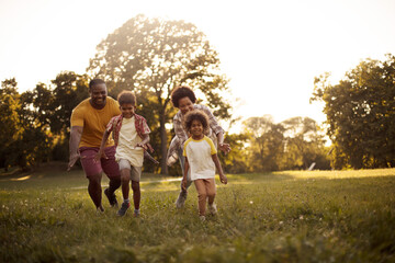  African American family having fun outdoors.