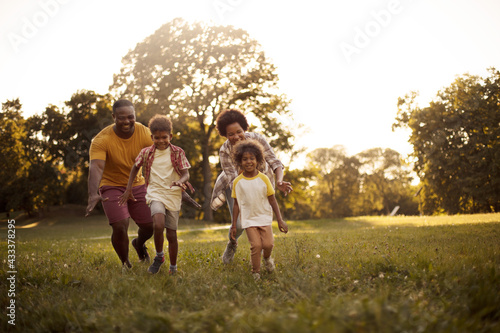  African American family having fun outdoors. photo