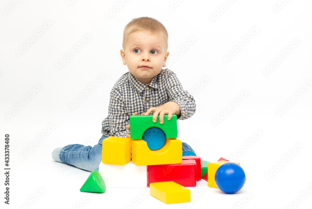 Boy playing with plastic toys white background isolated. Boy playing with plastic toys white background isolated.