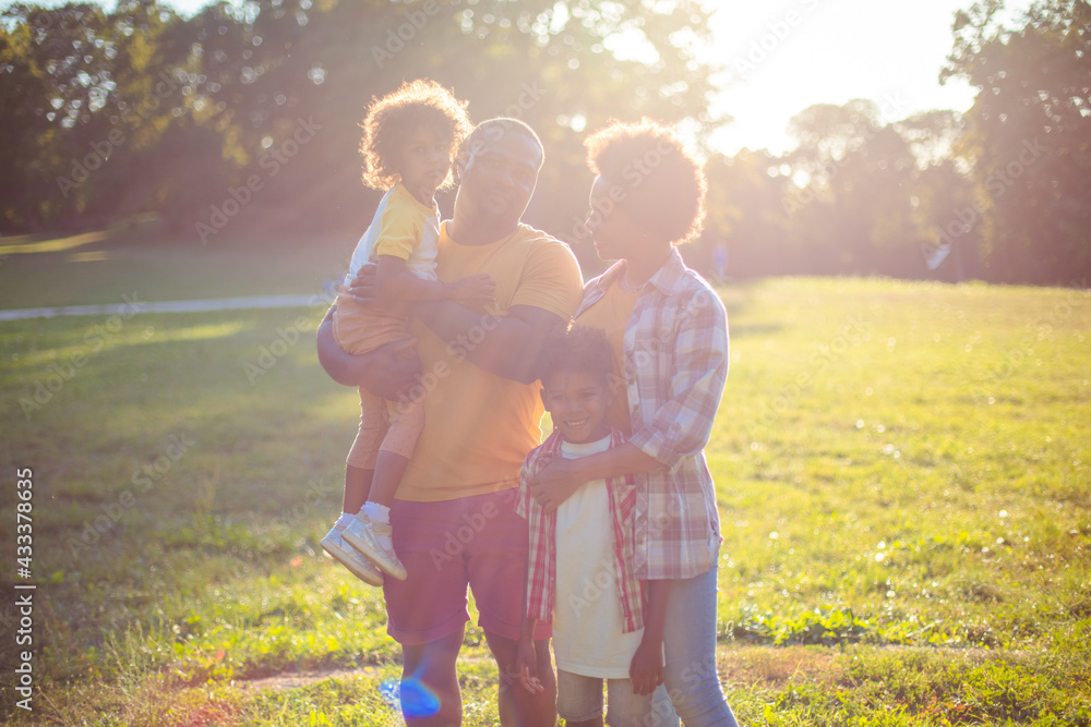 Fototapeta premium Portrait of African American family in nature. African American family having fun outdoors.