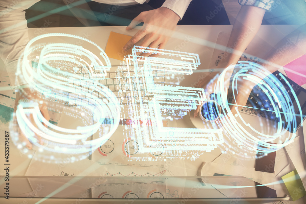 Double exposure of man and woman working together and SEO hologram drawing. Search engine concept. Computer background. Top View. Double exposure of man and woman working together and SEO hologram drawing. Search engine concept. Computer background. Top View.