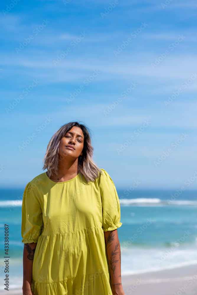 Portrait of beautiful woman at the beach with her eyes closed Portrait of beautiful woman at the beach with her eyes closed