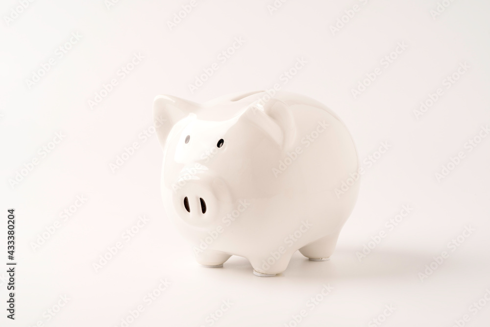 White  piggy bank saving on white background and copy space ,Money saving for future investment and retirement concept.