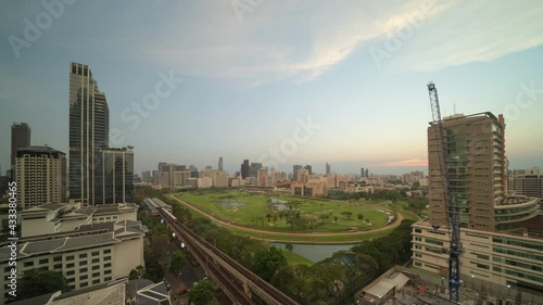 Time lapse of aerial view of Bangkok Sports Club, golf field in Ratchadamri district, Bangkok Downtown Skyline. Thailand. Financial district in smart urban city in Asia. Skyscraper building. photo