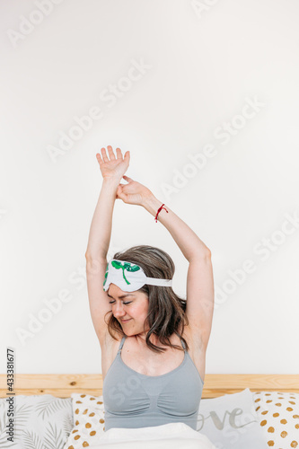 Girl in bed woke up, sleep, morning, morning procedures, Breakfast, pillow, sleep mask, hands