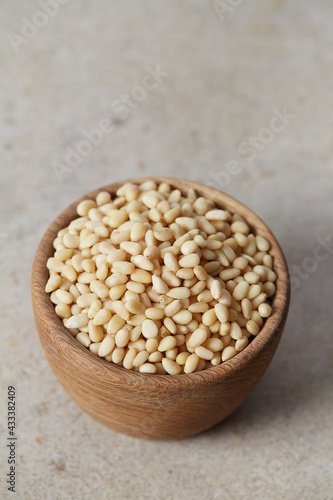 pine nuts in a wooden bowl