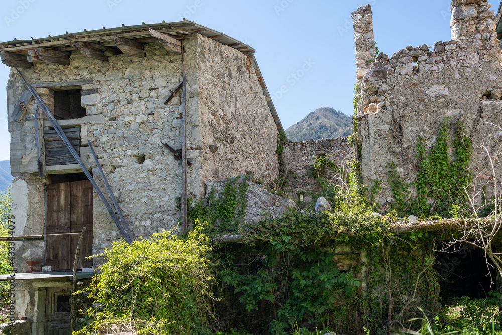 The abandoned and dilapidated mountain village of Moggessa, carnic Alps, Moggio Udinese, Udine province, Friuli Venezia Giulia, Italy. Earthquake consequence. The abandoned and dilapidated mountain village of Moggessa, carnic Alps, Moggio Udinese, Udine province, Friuli Venezia Giulia, Italy. Earthquake consequence.