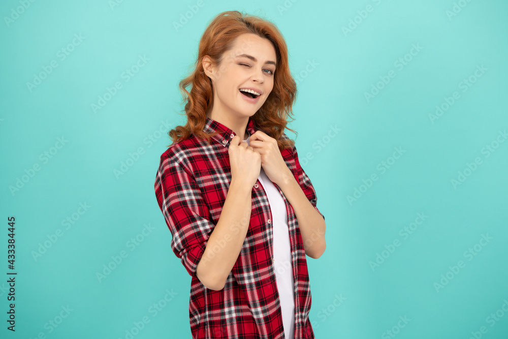 happy redhead woman with curly hair in checkered casual shirt, beauty happy redhead woman with curly hair in checkered casual shirt, beauty