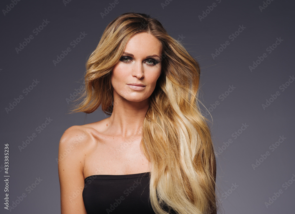 Beautiful woman withblonde hairstyle beauty over dark background Beautiful woman withblonde hairstyle beauty over dark background
