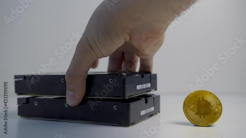 Concept of cryptocurrency mining. Mining cryptocurrency coins using hard disk drives. photo