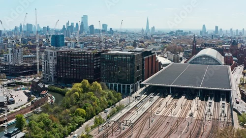 Descending drone shot of train tracks heading into London St Pancras station photo